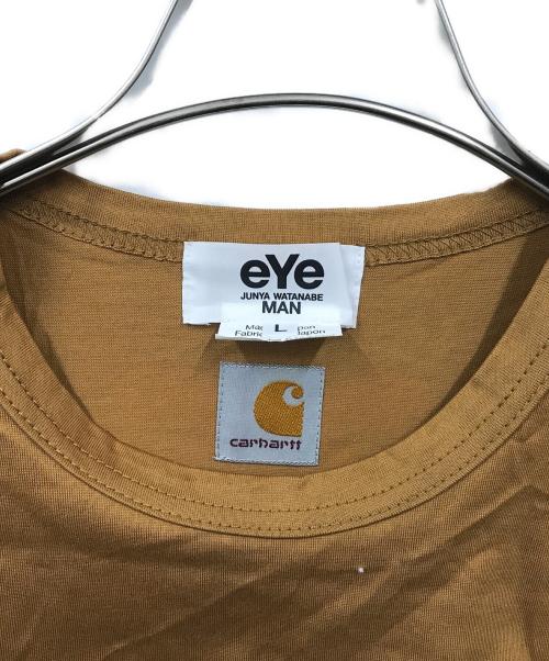 eYe COMME des GARCONS JUNYAWATANABE MAN（アイ コム デ ギャルソン ジュンヤ ワタナベ マン）eYe COMME des GARCONS JUNYAWATANABE MAN (アイ コム デ ギャルソン ジュンヤ ワタナベ マン) CarHartt (カーハート) コラボプリントTシャツ ブラウン サイズ:Lの古着・服飾アイテム