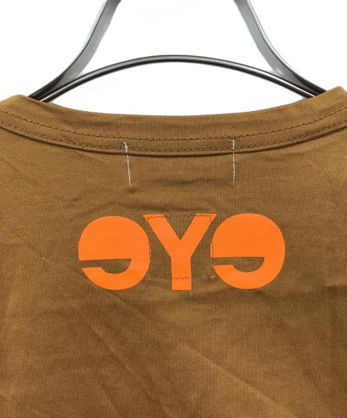 eYe COMME des GARCONS JUNYAWATANABE MAN（アイ コム デ ギャルソン ジュンヤ ワタナベ マン）eYe COMME des GARCONS JUNYAWATANABE MAN (アイ コム デ ギャルソン ジュンヤ ワタナベ マン) CarHartt (カーハート) コラボプリントTシャツ ブラウン サイズ:Lの古着・服飾アイテム