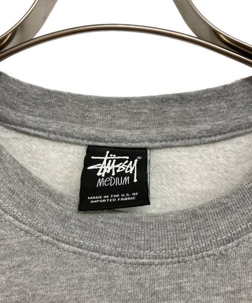 stussy（ステューシー）stussy (ステューシー) ワールドツアースウェット グレー サイズ:MEDIUMの古着・服飾アイテム