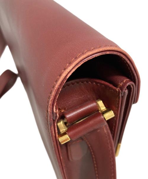 must de cartier（マストドゥカルティエ）must de cartier (マストドゥカルティエ) ショルダーバッグ レッドの古着・服飾アイテム