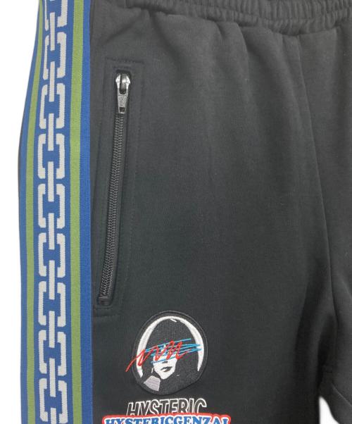 genzai（ゲンザイ）genzai (ゲンザイ) Hysteric Glamour (ヒステリックグラマー) コラボトラックパンツ ブラック サイズ:M 未使用品の古着・服飾アイテム