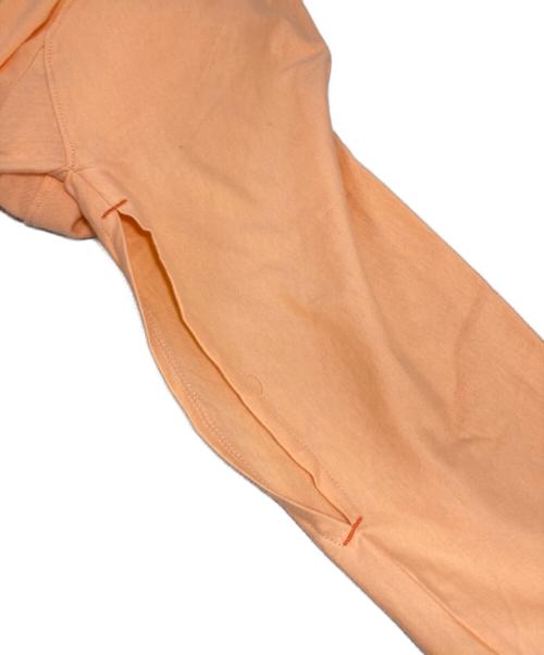 nagonstans（ナゴンスタンス）nagonstans (ナゴンスタンス) washable asymmetry 2way sleeves tops オレンジ サイズ:MEDIUMの古着・服飾アイテム