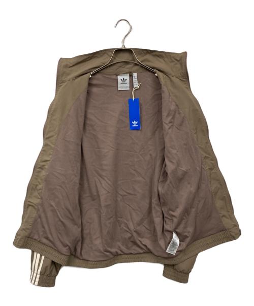 adidas（アディダス）adidas (アディダス) アディカラー ウーブン ファイヤーバード トラックトップ ブラウン サイズ:L 未使用品の古着・服飾アイテム