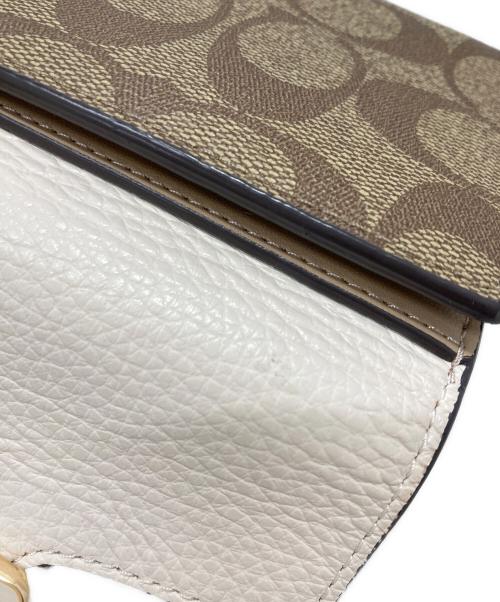 COACH（コーチ）COACH (コーチ) 2つ折り財布 ベージュの古着・服飾アイテム