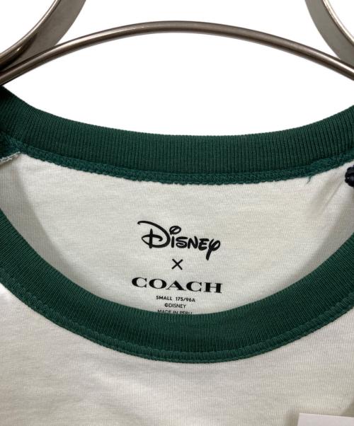COACH（コーチ）COACH (コーチ) DISNEY (ディズニー) ラグランTシャツ ホワイト×グリーン サイズ:SMALL 未使用品の古着・服飾アイテム