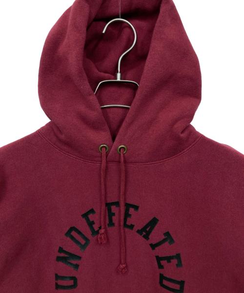 Champion（チャンピオン）Champion (チャンピオン) UNDEFEATED (アンディフィーテッド) パーカー レッド サイズ:MEDIUMの古着・服飾アイテム