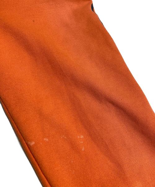 CarHartt（カーハート）CarHartt (カーハート) 袖プリントパーカー オレンジ サイズ:XLの古着・服飾アイテム