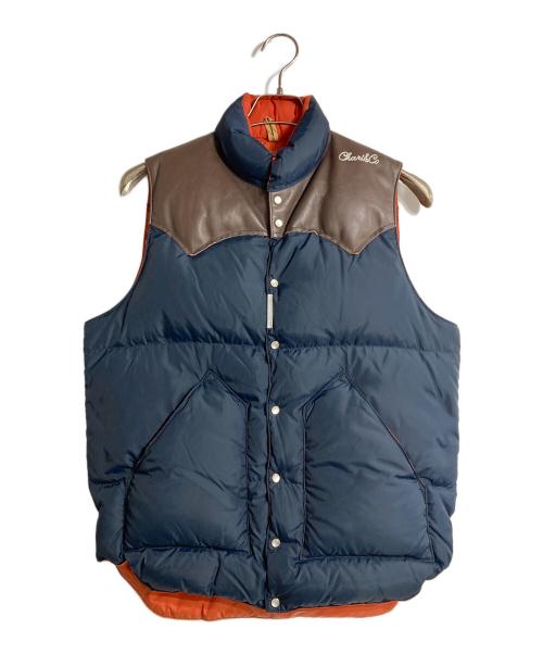 RockyMountainFeatherBed（ロッキーマウンテンフェザーベッド）RockyMountainFeatherBed (ロッキーマウンテンフェザーベッド) CHARI & CO NYC (チャリアンドコーニューヨーク) 別注ロゴ刺繍ダウンベスト ブラウン×ネイビー サイズ:Sの古着・服飾アイテム
