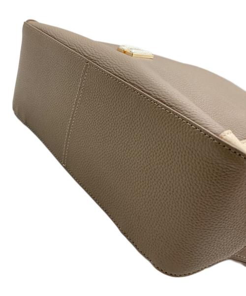 COLE HAAN（コールハーン）COLE HAAN (コールハーン) グランド アンビション スモール コンバーチブルバックパック ベージュ×アイボリーの古着・服飾アイテム