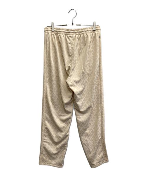 adidas（アディダス）adidas (アディダス) モノグラムトラックパンツ ベージュ サイズ:XL 未使用品の古着・服飾アイテム