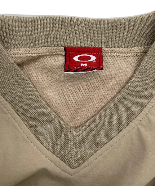 OAKLEY（オークリー）OAKLEY (オークリー) 90s~00s メタルロゴ プルオーバーカットソー ベージュ サイズ:Mの古着・服飾アイテム