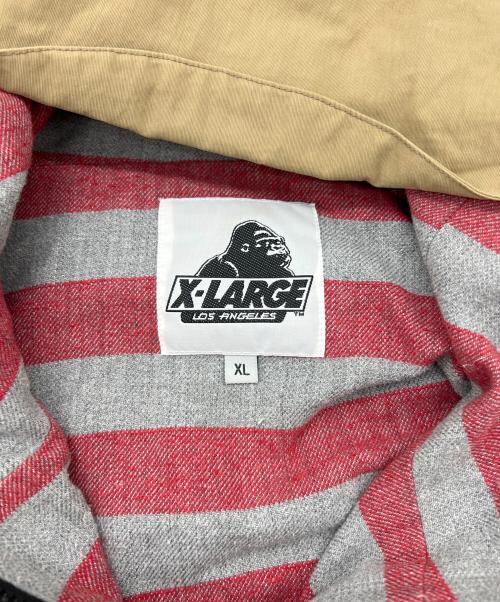 X-LARGE（エクストララージ）X-LARGE (エクストララージ) WILD THINGS (ワイルドシングス) コラボマウンテンパーカー ベージュ サイズ:XLの古着・服飾アイテム