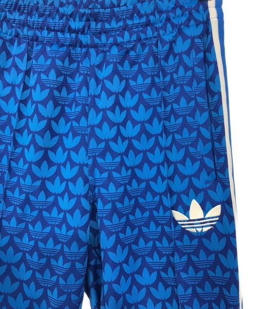 adidas（アディダス）adidas (アディダス) モノグラムトラックパンツ ブルー サイズ:SIZE　Mの古着・服飾アイテム