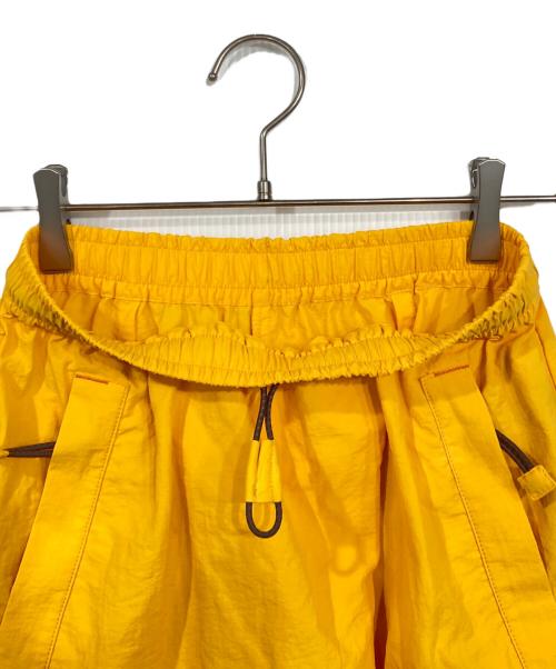 nagonstans（ナゴンスタンス）nagonstans (ナゴンスタンス) 撥水ドレープポケットスカート イエロー サイズ:SMALLの古着・服飾アイテム