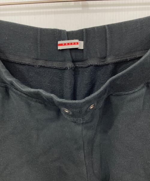 PRADA SPORTS（プラダスポーツ）PRADA SPORTS (プラダスポーツ) 裾ロゴラバーパッチスウェットパンツ ブラック サイズ:Ｍの古着・服飾アイテム