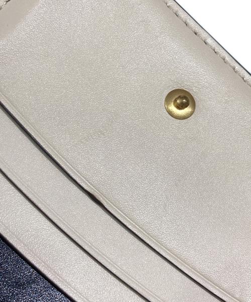 TORY BURCH（トリーバーチ）TORY BURCH (トリーバーチ) Tモノグラム2つ折り財布 ブラックの古着・服飾アイテム