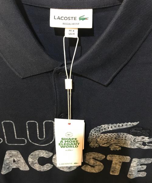 LACOSTE（ラコステ）LACOSTE (ラコステ) ヴィンテージプリント ポロシャツ ネイビー サイズ:M 未使用品の古着・服飾アイテム