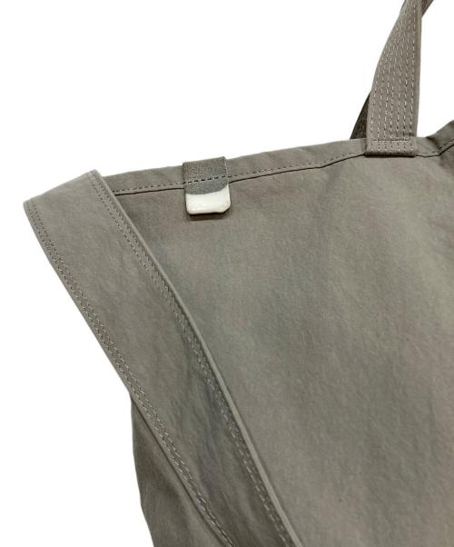 ANUNFOLD（アヌンフォルド）ANUNFOLD (アヌンフォルド) SIDE POCKET TOTE グレーの古着・服飾アイテム