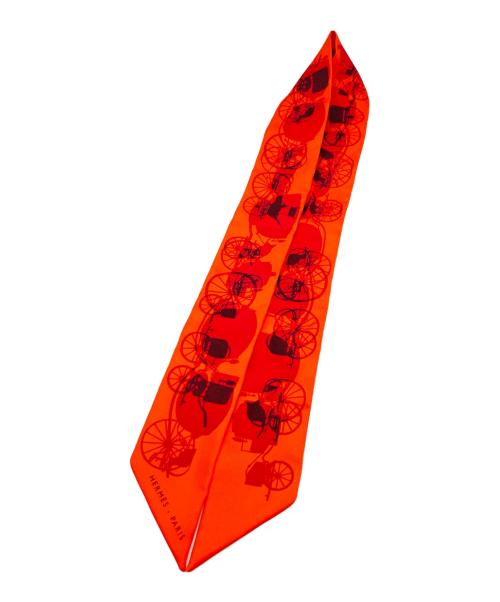 HERMES（エルメス）HERMES (エルメス) 馬車柄ツイリースカーフ オレンジの古着・服飾アイテム