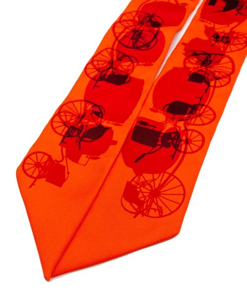HERMES（エルメス）HERMES (エルメス) 馬車柄ツイリースカーフ オレンジの古着・服飾アイテム