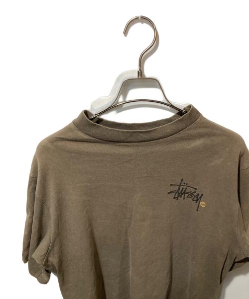 stussy（ステューシー）stussy (ステューシー) オールドプリントTシャツ ブラウン サイズ:Mの古着・服飾アイテム