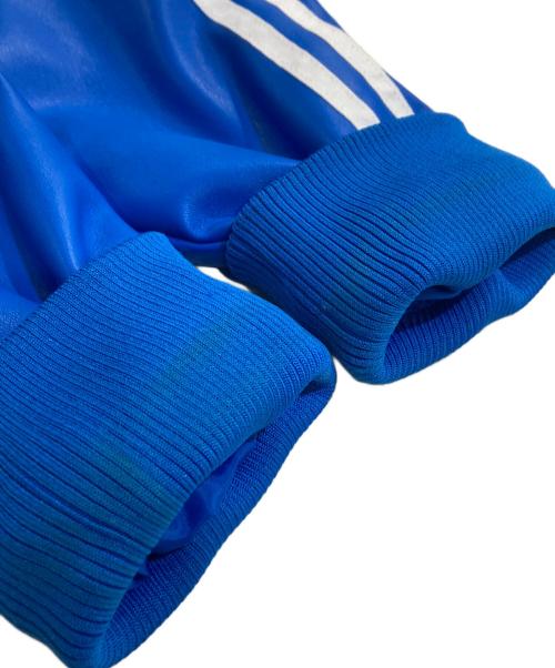 adidas（アディダス）adidas (アディダス) フェイクレザーアディカラールーズファイヤーバードトラックスーツジャケット ブルー サイズ:XLの古着・服飾アイテム