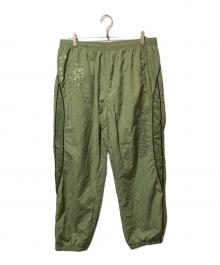 SUPREME（シュプリーム）の古着「AOI Glow-in-the-Dark Track Pant」｜グリーン