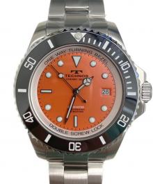 TECHNOS（テクノス）の古着「腕時計」｜オレンジ