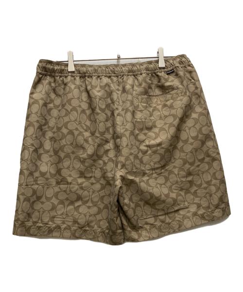 COACH（コーチ）COACH (コーチ) フェイデッド ブルー シグネチャー スイム トランクス ベージュ サイズ:Mの古着・服飾アイテム