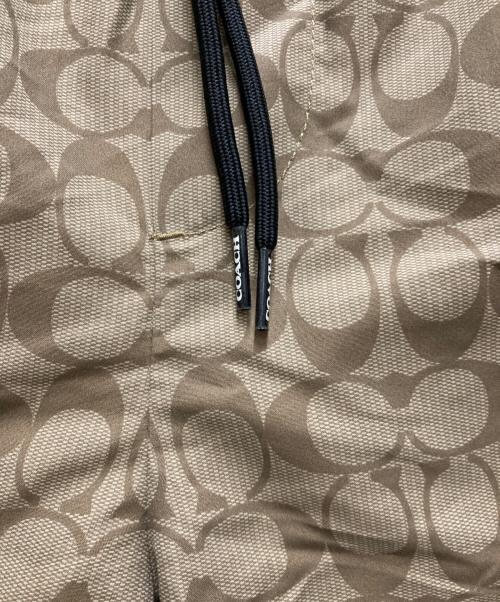 COACH（コーチ）COACH (コーチ) フェイデッド ブルー シグネチャー スイム トランクス ベージュ サイズ:Mの古着・服飾アイテム