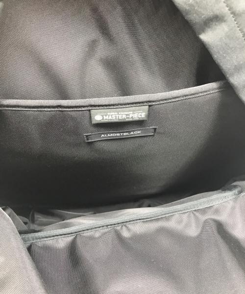 ALMOSTBLACK（オールモストブラック）ALMOSTBLACK (オールモストブラック) master-piece (マスターピース) グラフィックプリントバックパック ブラックの古着・服飾アイテム
