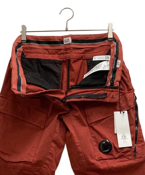 C.P COMPANY（シーピーカンパニー）C.P COMPANY (シーピーカンパニー) Lens Pocket Cargo Pants オレンジ サイズ:48の古着・服飾アイテム