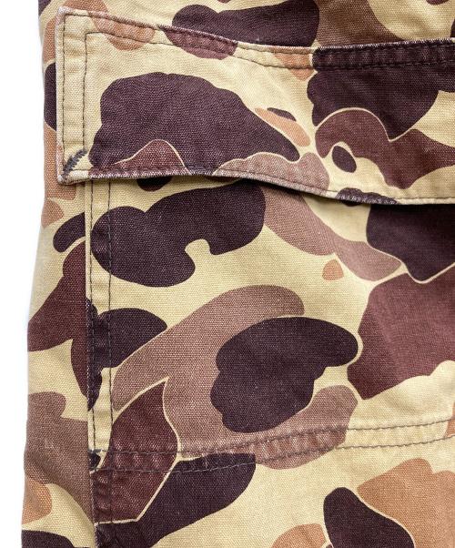 eYe COMME des GARCONS JUNYAWATANABE MAN（アイ コム デ ギャルソン ジュンヤ ワタナベ マン）eYe COMME des GARCONS JUNYAWATANABE MAN (アイ コム デ ギャルソン ジュンヤ ワタナベ マン) Dickies (ディッキーズ) カモフラワークパンツ イエロー×ブラウン サイズ:Lの古着・服飾アイテム