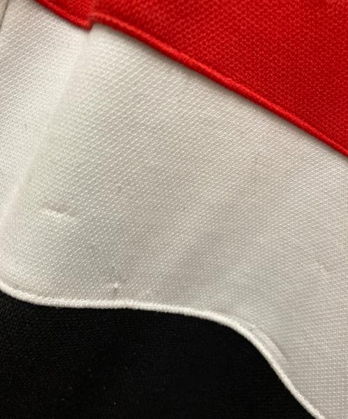 UMBRO（アンブロ）UMBRO (アンブロ) 90s Manchester United TRACK JACKET レッド×ブラック サイズ:Mの古着・服飾アイテム