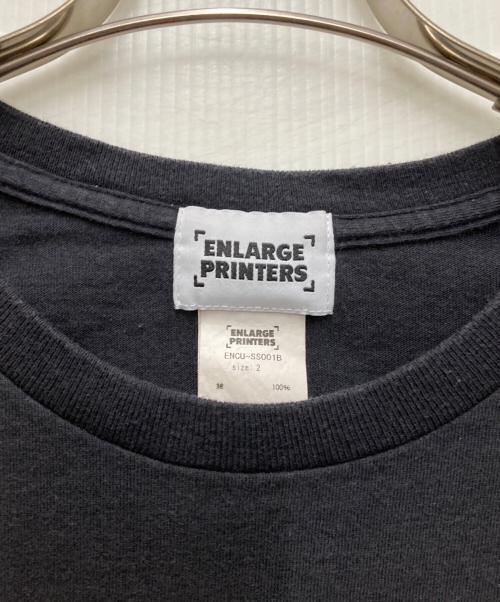ENLARGE PRINTERS（エンラージ・プリンターズ）ENLARGE PRINTERS (エンラージ・プリンターズ) FIGURE別注TEE ブラック サイズ:2の古着・服飾アイテム