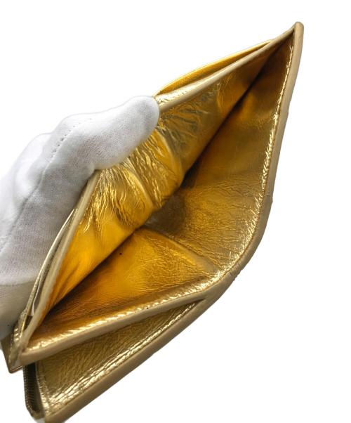 BOTTEGA VENETA（ボッテガベネタ）BOTTEGA VENETA (ボッテガベネタ) 2つ折り財布 ゴールドの古着・服飾アイテム