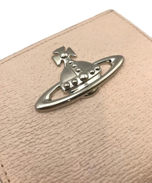 Vivienne Westwood（ヴィヴィアンウエストウッド）Vivienne Westwood (ヴィヴィアンウエストウッド) 口金2つ折りミニ財布 ピンクの古着・服飾アイテム