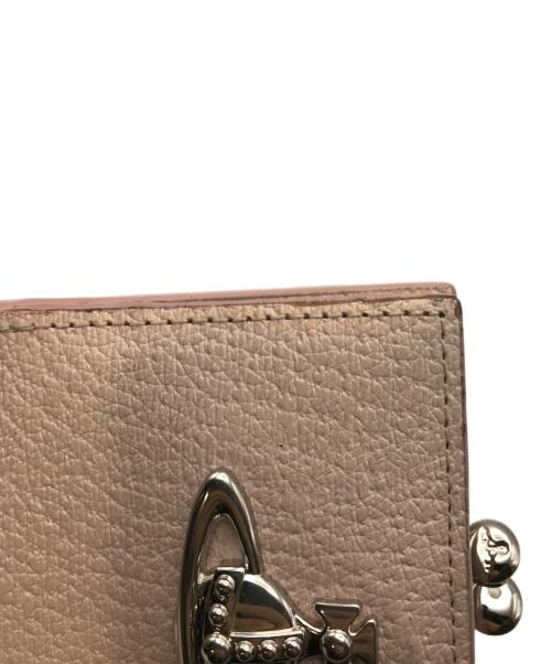 Vivienne Westwood（ヴィヴィアンウエストウッド）Vivienne Westwood (ヴィヴィアンウエストウッド) 口金2つ折りミニ財布 ピンクの古着・服飾アイテム