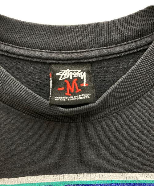 stussy（ステューシー）stussy (ステューシー) 00S カスタムメイドプリントTシャツ ブラック サイズ:Mの古着・服飾アイテム