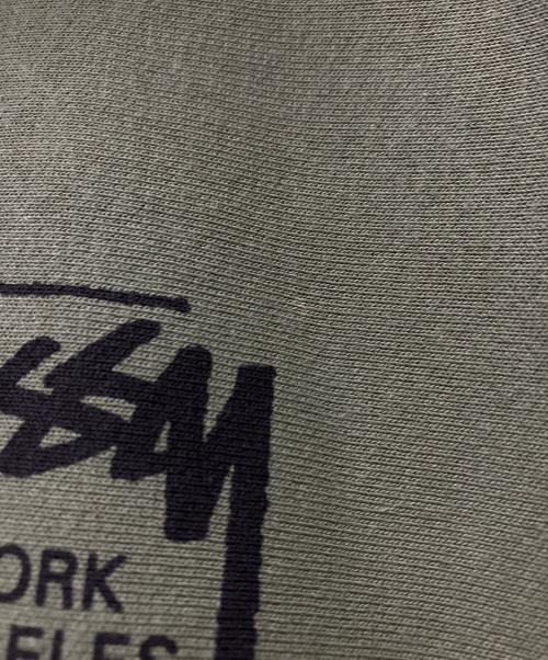 stussy（ステューシー）stussy (ステューシー) World Tour Hoodie カーキ サイズ:Sの古着・服飾アイテム