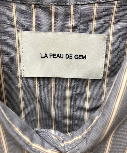 la peau de gem（ラポドゥジェム）la peau de gem (ラポドゥジェム) ドロストストライプシャツ スカイブルー サイズ:FREE 未使用品の古着・服飾アイテム