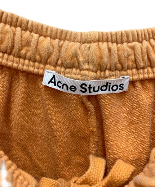 Acne studios（アクネ ストゥディオズ）ACNE STUDIOS (アクネ ストゥディオズ) ウォッシュ加工 ロゴスウェットパンツ オレンジ サイズ:XXSの古着・服飾アイテム