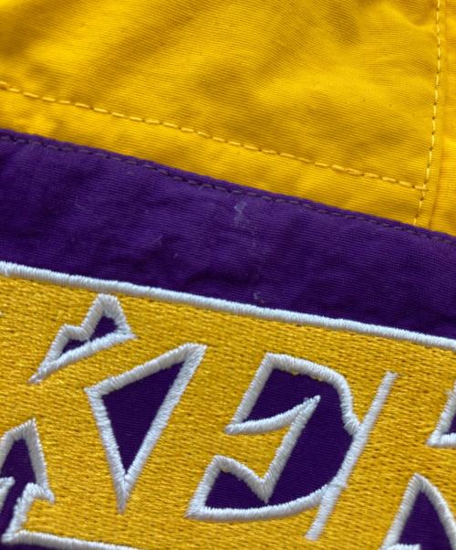 MITCHELL & NESS（ミッチェルアンドネス）MITCHELL & NESS (ミッチェルアンドネス) アノラックパーカー / レイカーズ / Lakers イエロー×パープル サイズ:XLの古着・服飾アイテム
