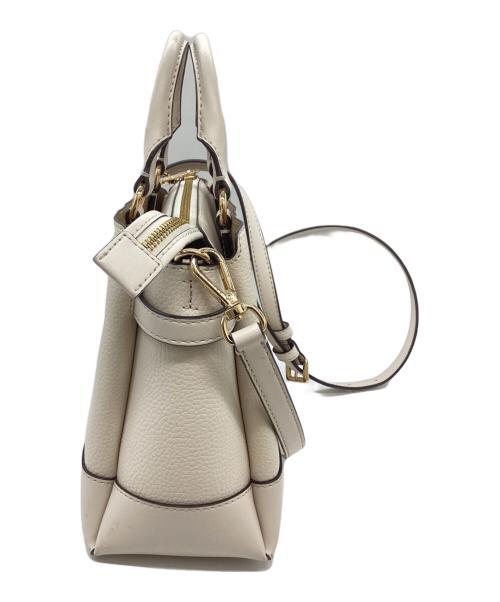 MICHAEL KORS（マイケル・コース）MICHAEL KORS (マイケル・コース) REED SM CZ BELTED STCHL LEAHTER / ベルト付きスティッチレザー / 35S3G6RS1T アイボリーの古着・服飾アイテム