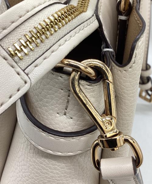 MICHAEL KORS（マイケル・コース）MICHAEL KORS (マイケル・コース) REED SM CZ BELTED STCHL LEAHTER / ベルト付きスティッチレザー / 35S3G6RS1T アイボリーの古着・服飾アイテム