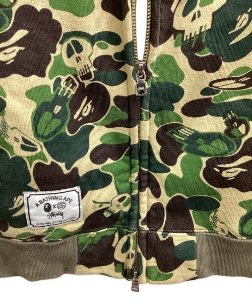 A BATHING APE（ア ベイシング エイプ）A BATHING APE (アベイシングエイプ) stussy (ステューシー) スカルサルカモジップパーカー / 30周年記念 / 10AW グリーン サイズ:Lの古着・服飾アイテム