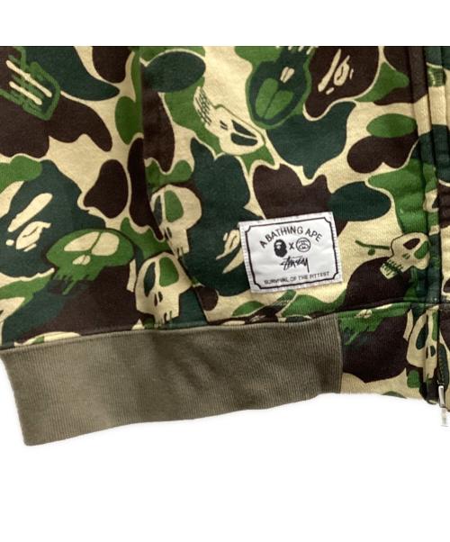 A BATHING APE（ア ベイシング エイプ）A BATHING APE (アベイシングエイプ) stussy (ステューシー) スカルサルカモジップパーカー / 30周年記念 / 10AW グリーン サイズ:Lの古着・服飾アイテム