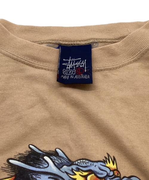stussy（ステューシー）stussy (ステューシー) ドラゴンTシャツ ベージュ サイズ:Lの古着・服飾アイテム