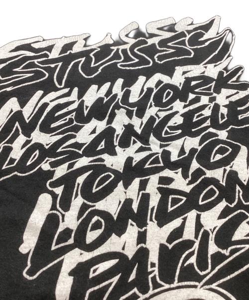 stussy（ステューシー）stussy  (ステューシー) WORLD TOUR TEE / ワールドツアーＴシャツ /  JIM PHILLIPS ブラック サイズ:XLの古着・服飾アイテム