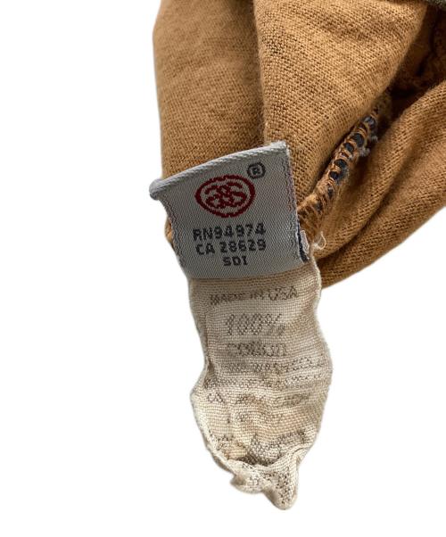 stussy（ステューシー）stussy (ステューシー) REGGAE TOMTOM 総柄タンクトップ / USA製 OLD ブラウン サイズ:Lの古着・服飾アイテム
